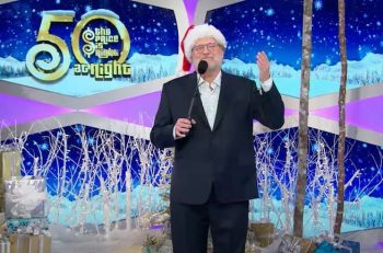 Drew Carey, wearing a Santa hat, hosts a holiday edition of The Price Is Right At Night for CBS